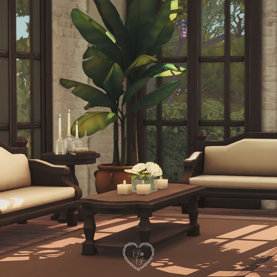 Cozy sitting area with dark wood accents and lush window views