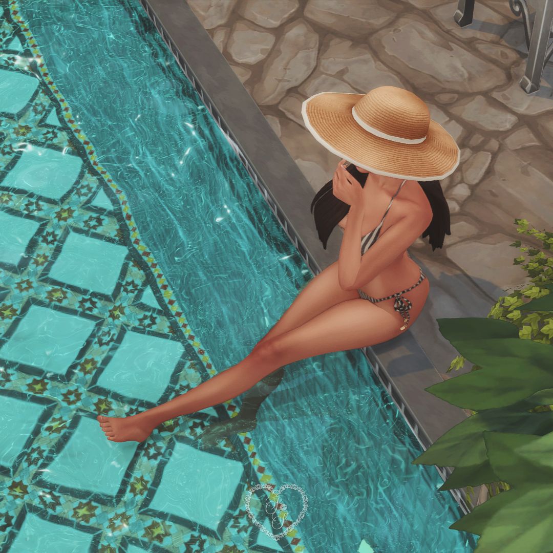 Sim relaxing by the courtyard pool of a luxury home.