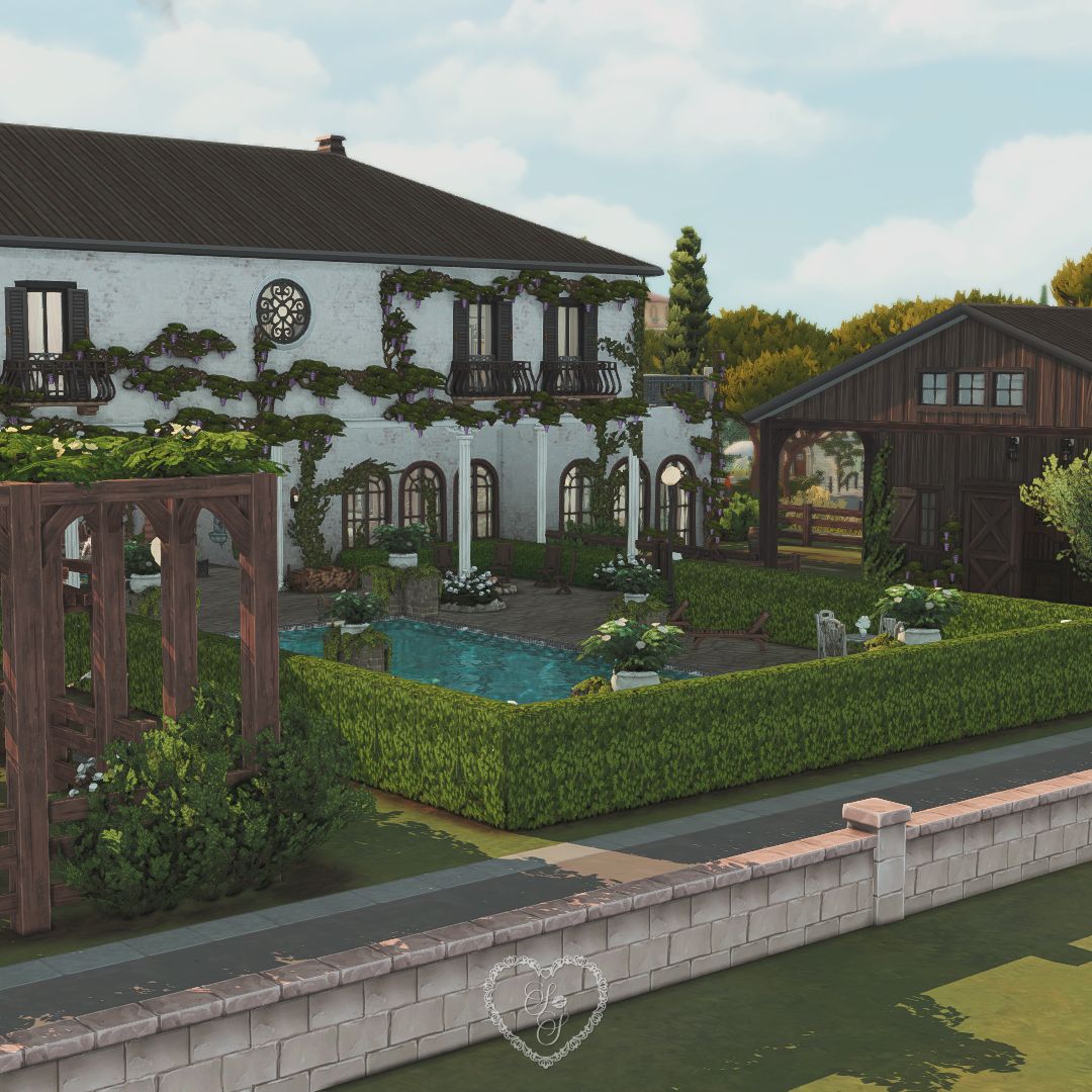 Full backyard view of Mediterranean Villa featuring pool, vines, and rustic horse stables