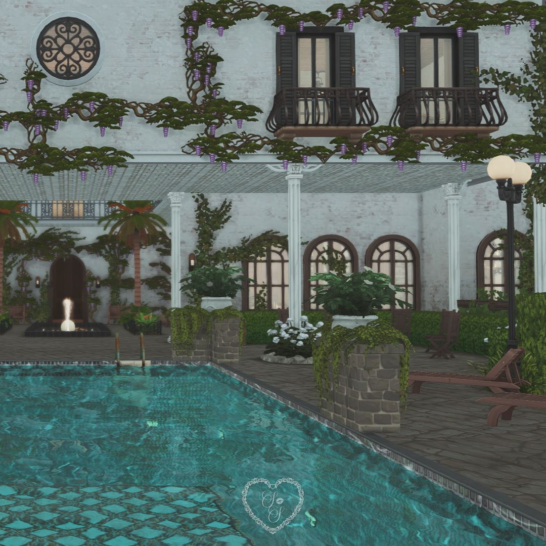 Courtyard and pool with wisteria-covered balconies and elegant columns