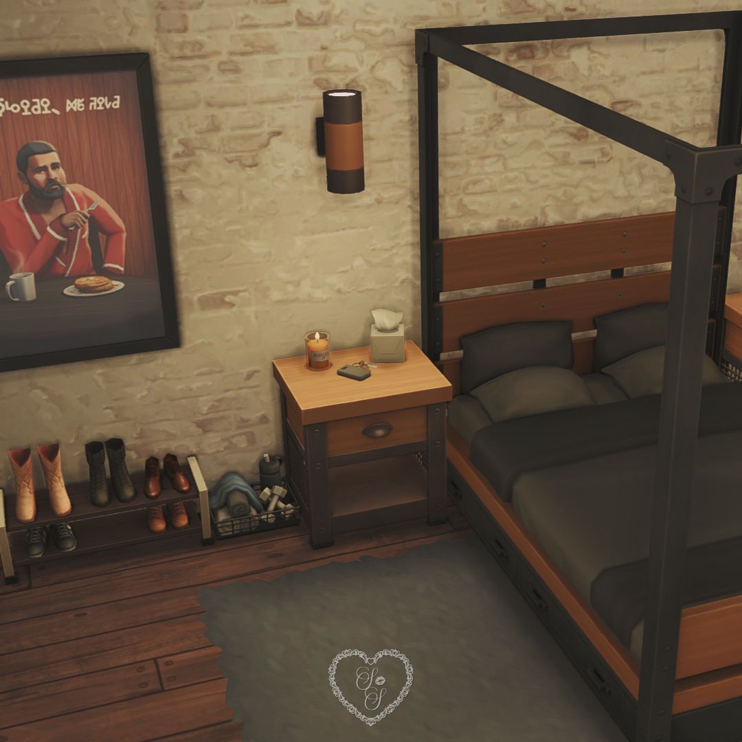 Industrial-style bedroom in with a black metal canopy bed, wood nightstand, cozy gray rug, and framed artwork featuring a Bob Pancakes Sim eating pancakes.