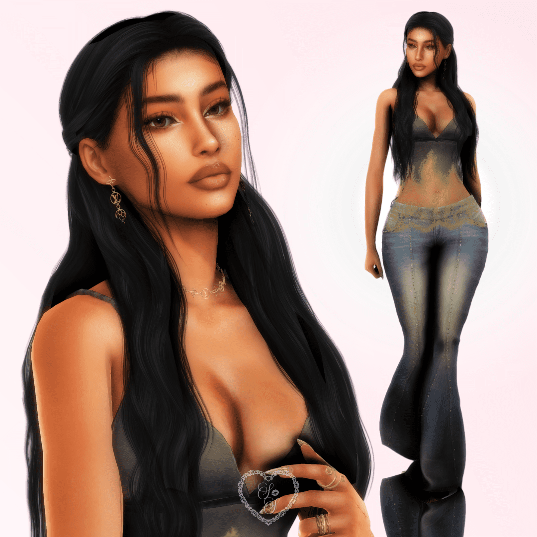 Samaya lifts her hand near her chest, showing off her rings and natural glam makeup, while posing in a sheer olive top.