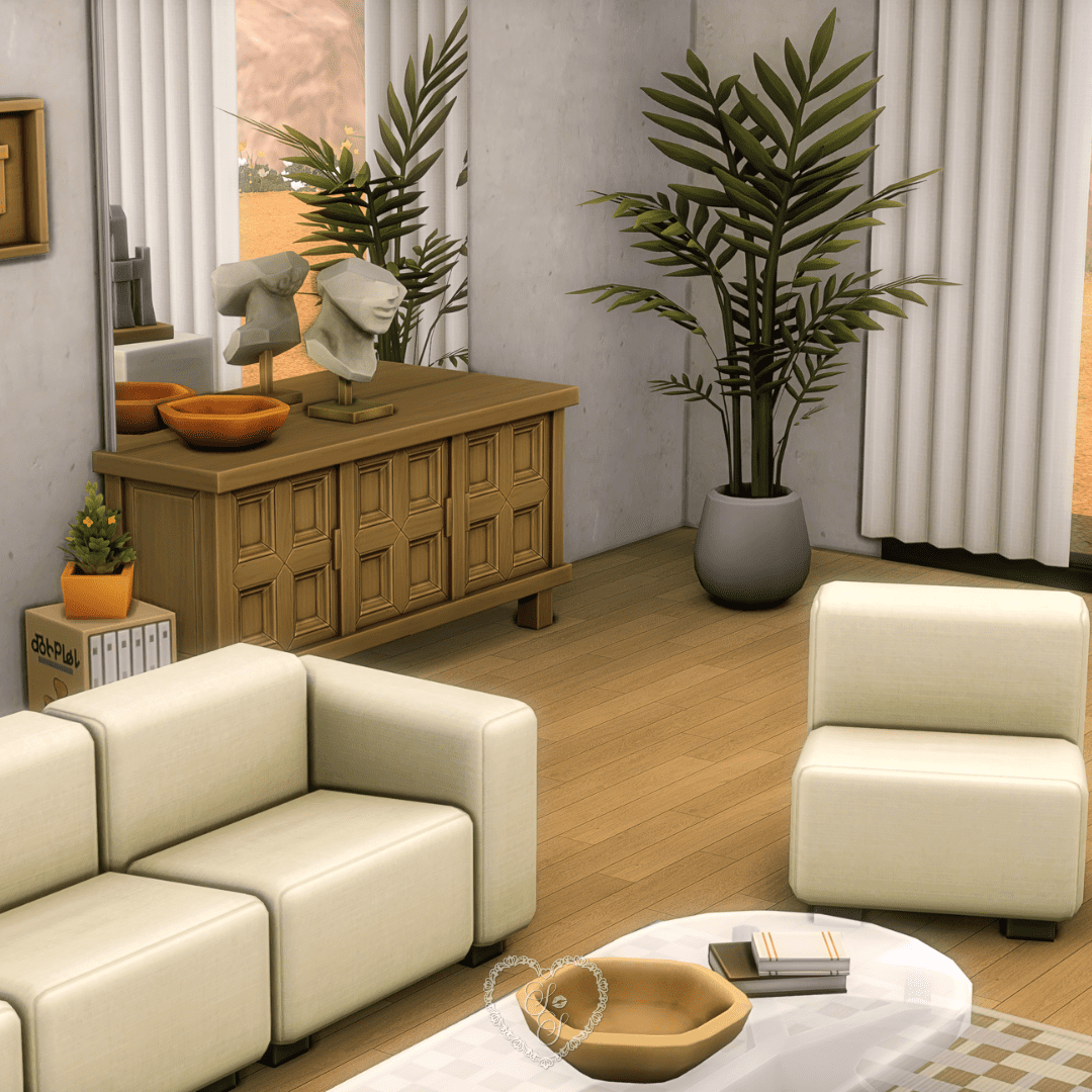 A stylish vignette showing a sculptural console table with decorative busts, planters, and ambient lighting near floor-length curtains.