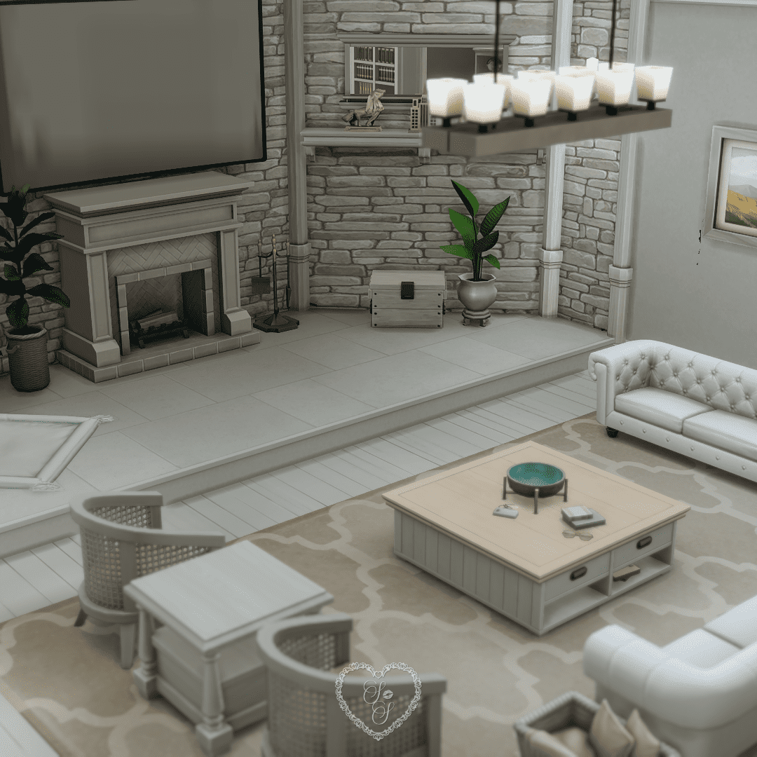 A cozy living room featuring a stone fireplace, built-in TV, white tufted sofas, and soft neutral decor.