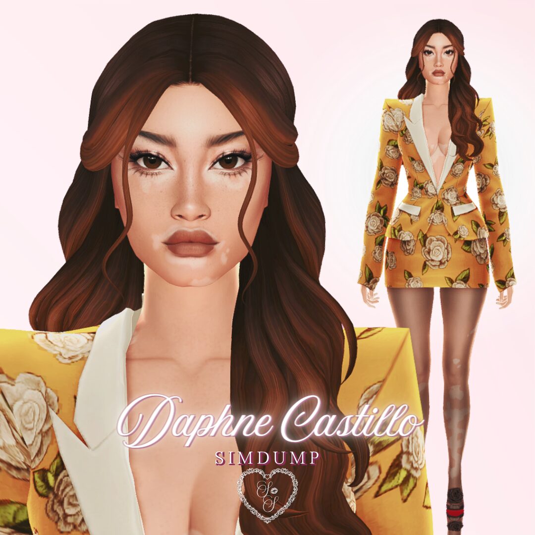 Daphne Castillo poses in a golden yellow floral blazer dress, with long brown hair styled in waves and a confident expression.