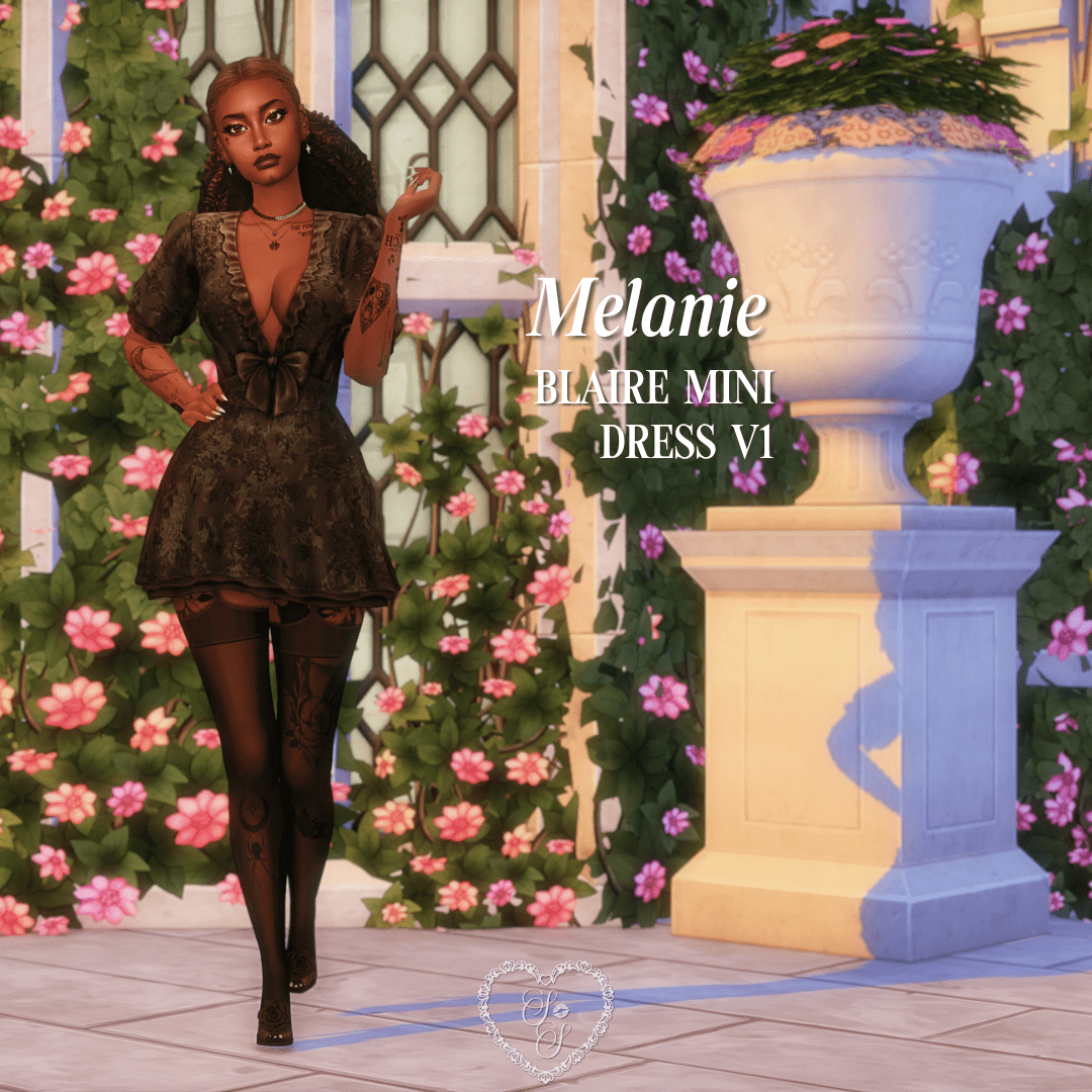 Melanie walks confidently in a gothic-inspired black floral mini dress and thigh-high patterned stockings, standing out among pastel blooms.