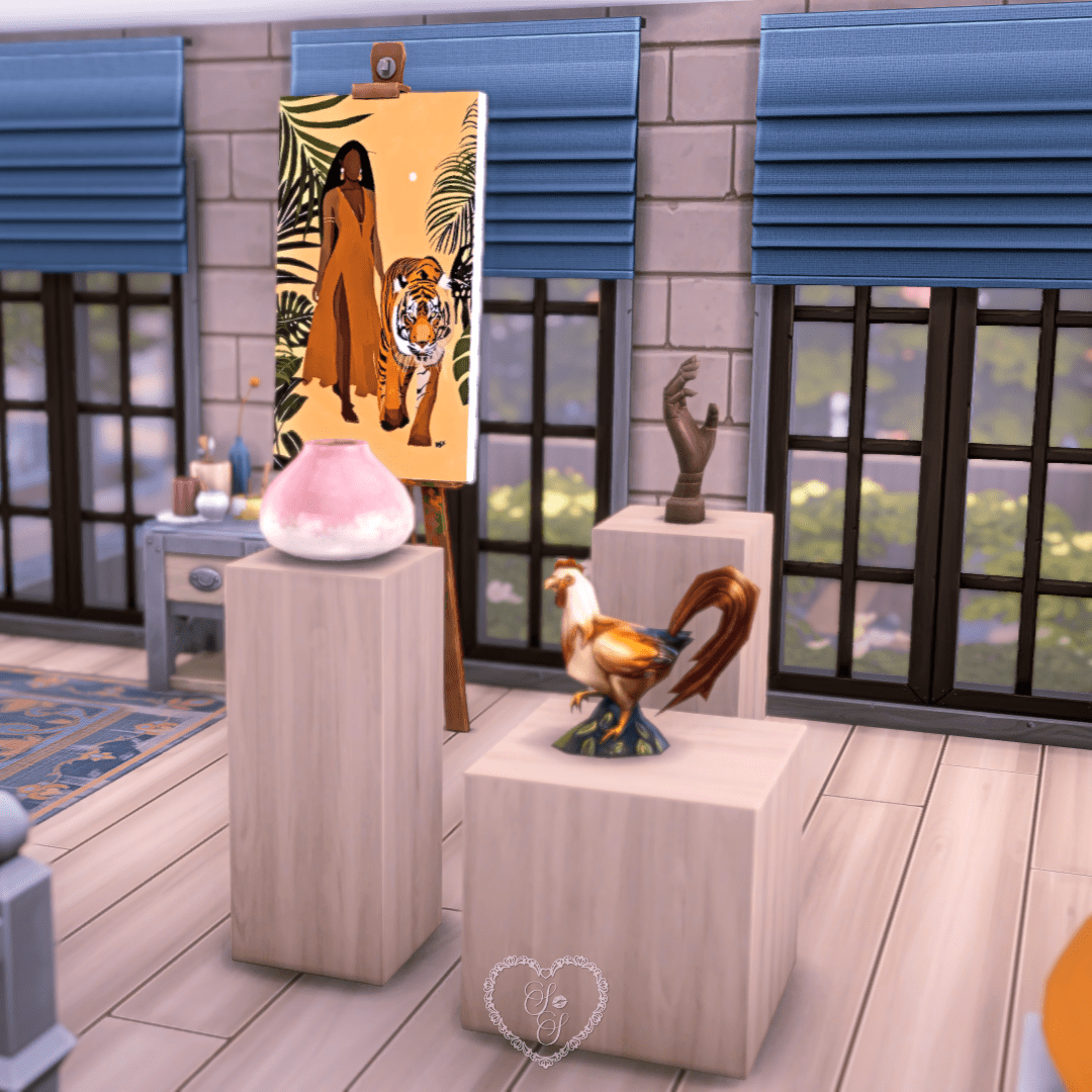 A Sims 4 art studio display featuring a bold painting of a woman and tiger, alongside decorative sculptures on minimalist pedestals.