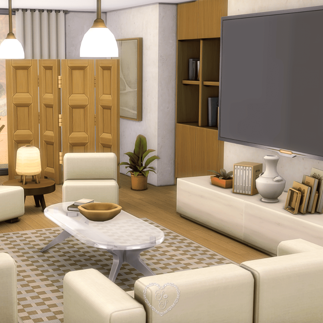 A sleek living room view featuring a wall-mounted flatscreen TV, built-in bookcases, and soft cream sofas arranged around a glass coffee table.