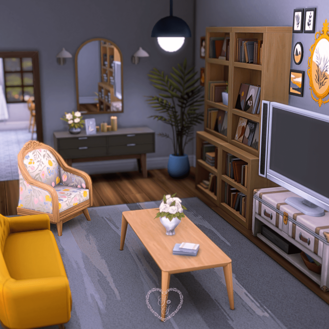 The apartment living room with a mustard yellow couch, floral armchair, TV console, and warm-toned bookshelves filled with décor.