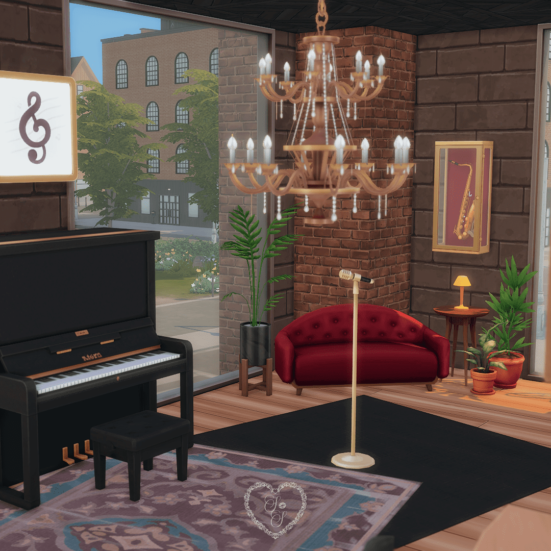 The live music lounge upstairs includes a piano, golden microphone, plush red loveseat, and elegant chandelier—designed for cozy performances.
