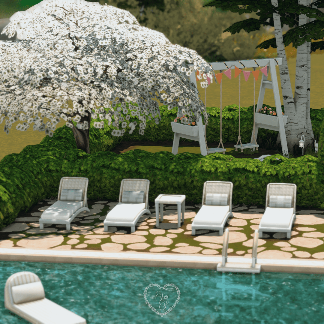 A relaxing poolside scene with white lounge chairs, stone patio, and a flower-covered tree near the swingset.