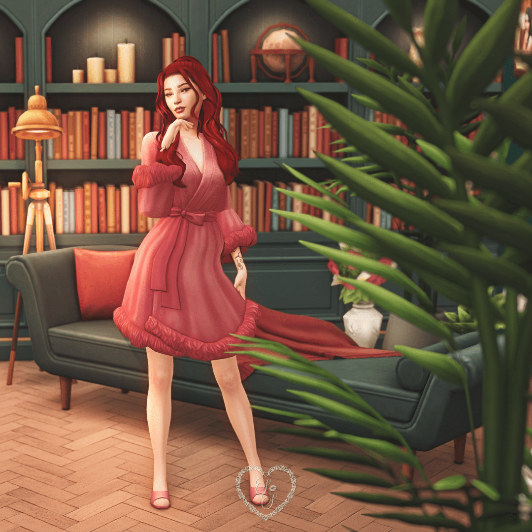 A red-haired Sim in a glam dressing robe poses playfully beside a curved bookshelf and vintage floor lamp in a moody lounge setting.