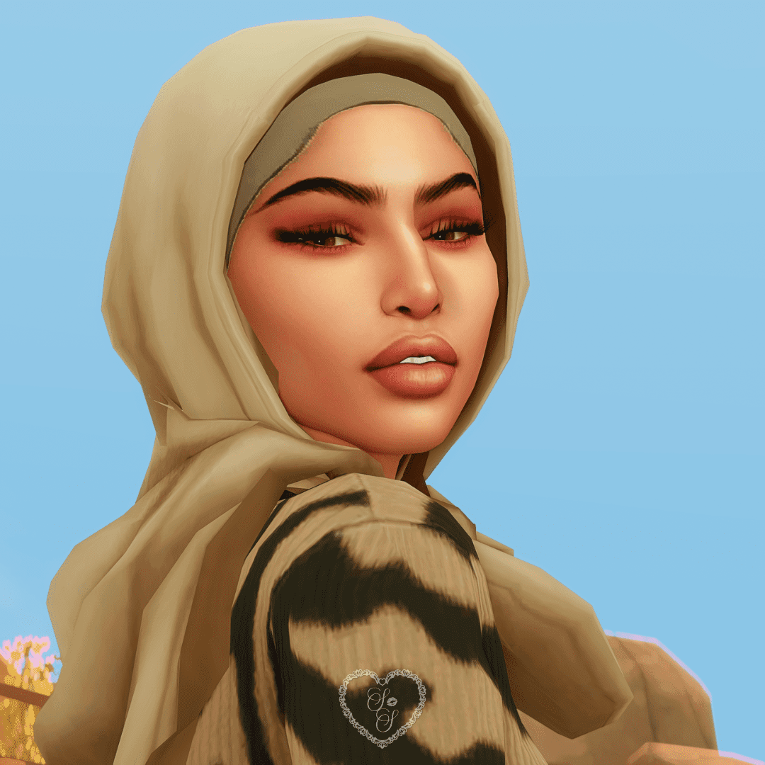 Yasmin Abu-Saleh turns her head over her shoulder with a confident smirk, set against a bright blue sky and rocky backdrop.