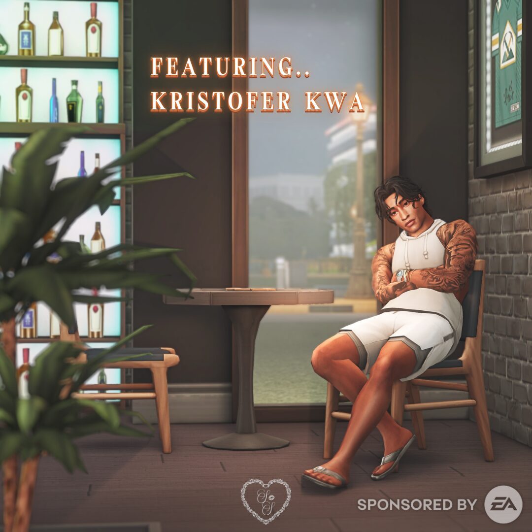 Kristofer Kwa poses casually at a café table in a sporty sleeveless hoodie and matching shorts, showing off his tattoos and summer vibe.