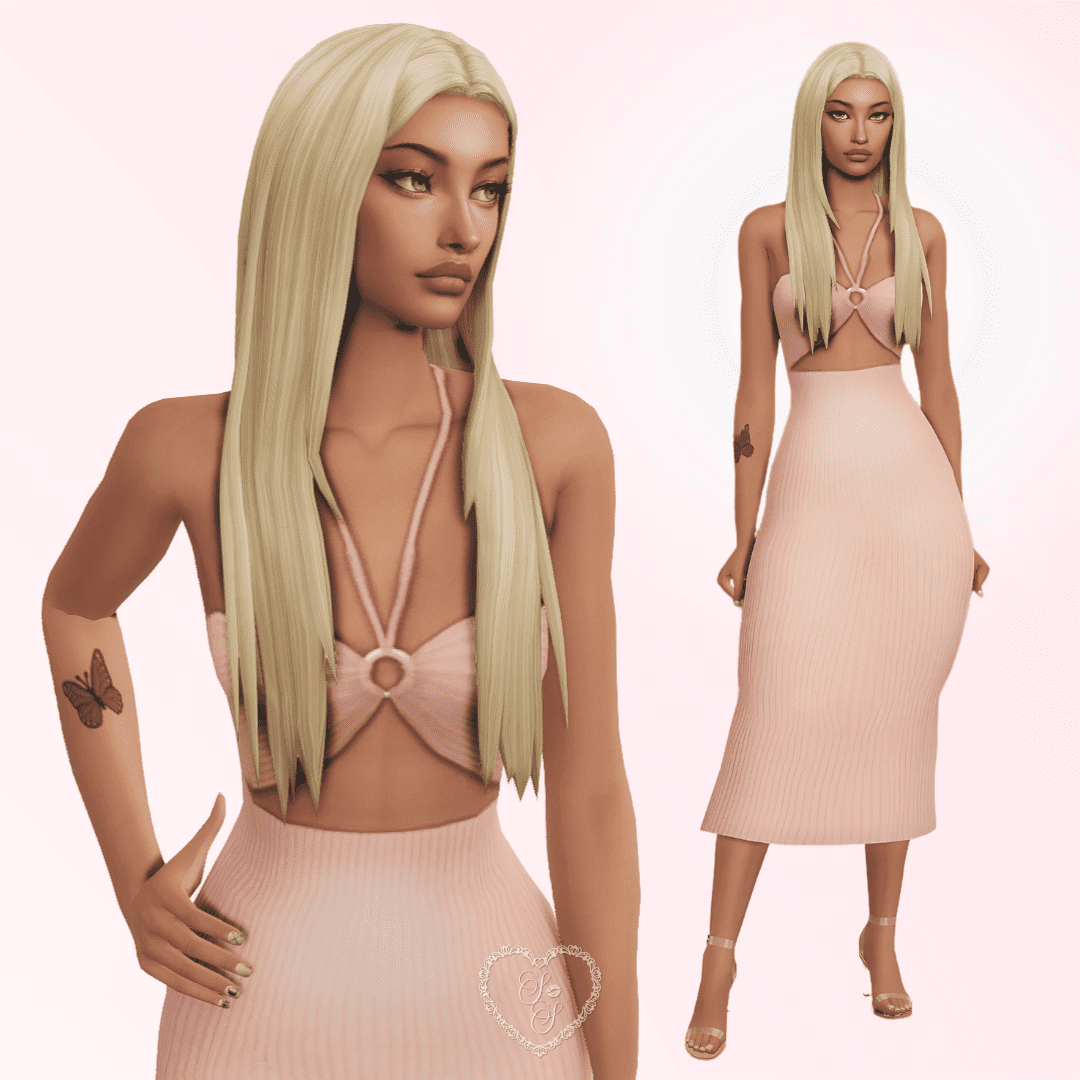 Lori Ashby in a trendy pink halter crop top and midi skirt set, showing off a butterfly tattoo and glam high heels.