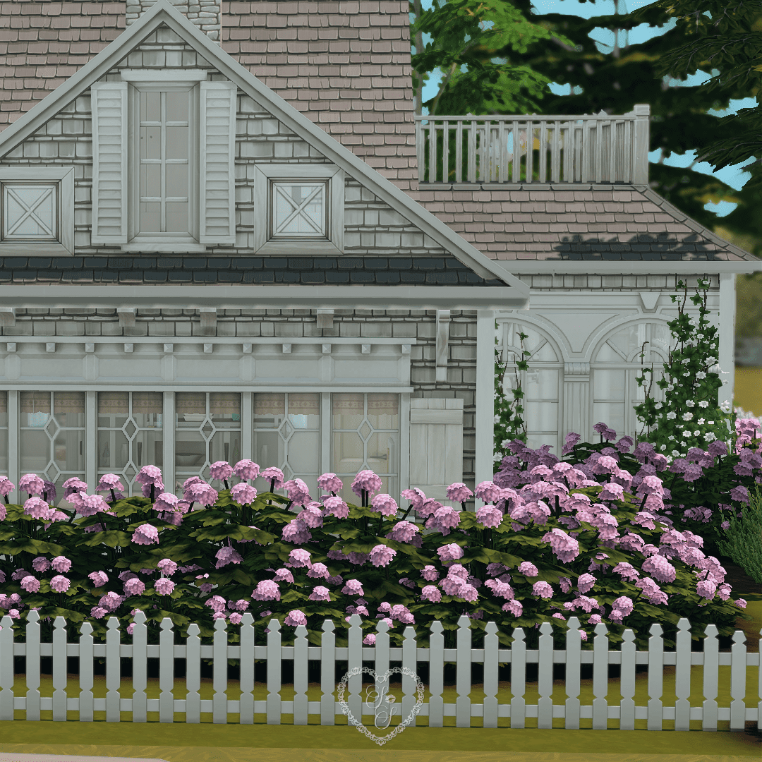Close-up of the estate’s exterior showcasing cottage-style siding, trimmed hedges, and a full bloom of pink hydrangeas.
