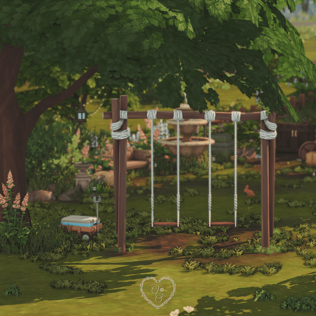 Rope swing set beneath a large tree, with soft shadows, wildflowers, and a nearby picnic cooler—an ideal spot for family fun.