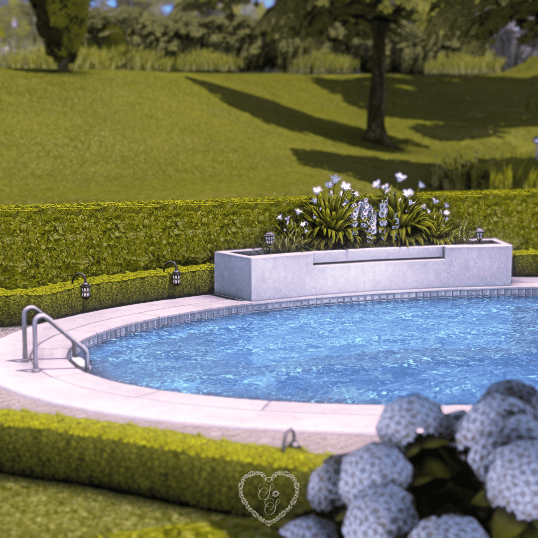 Decorative flowerbed and sculpted hedge detail beside oval pool