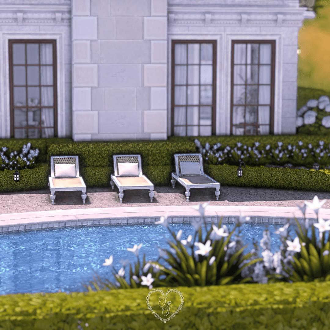 Luxurious poolside view with hedges, lounge chairs, and Chateau-inspired landscaping