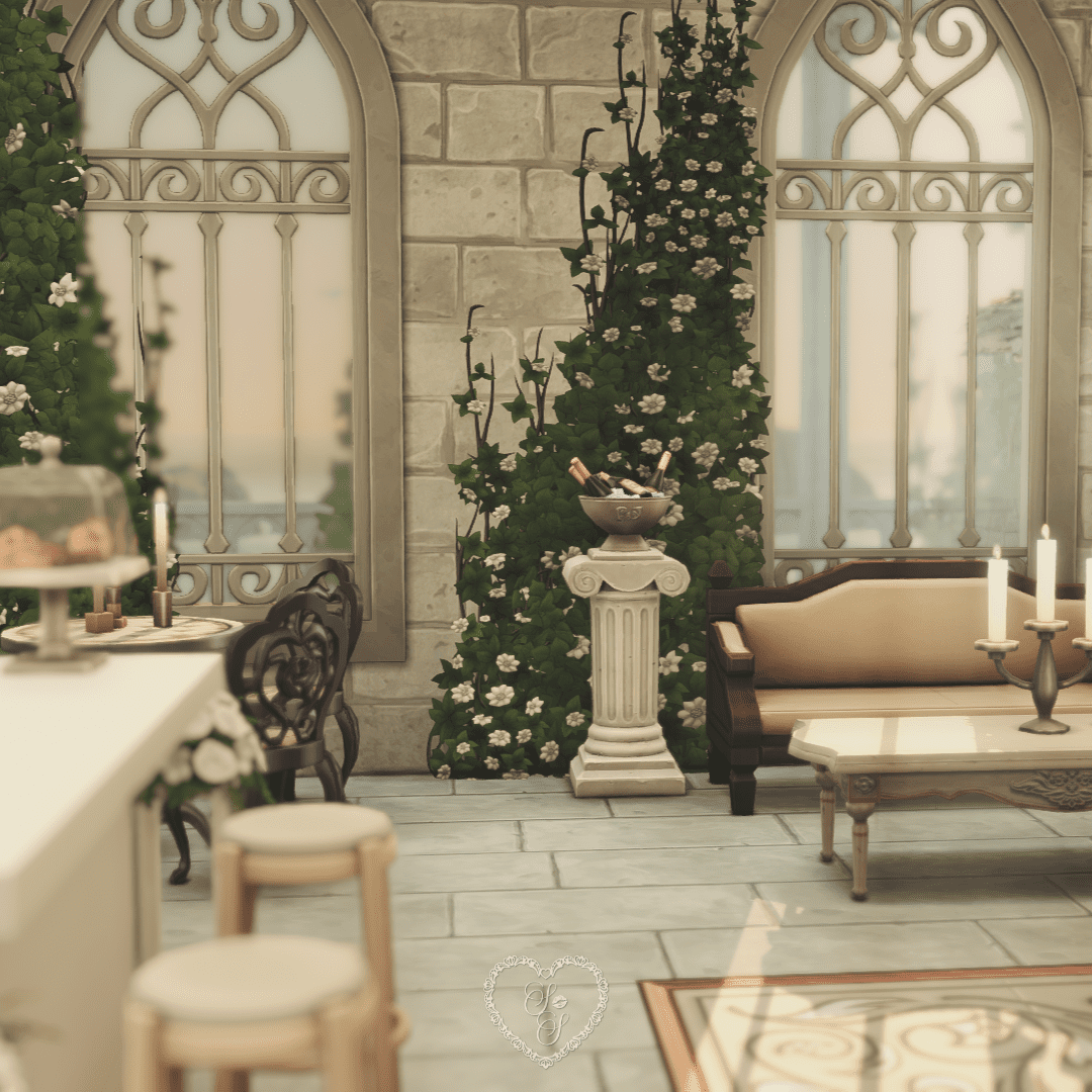 Cozy lounge area with classical seating, candles, and celebratory details like champagne on display.