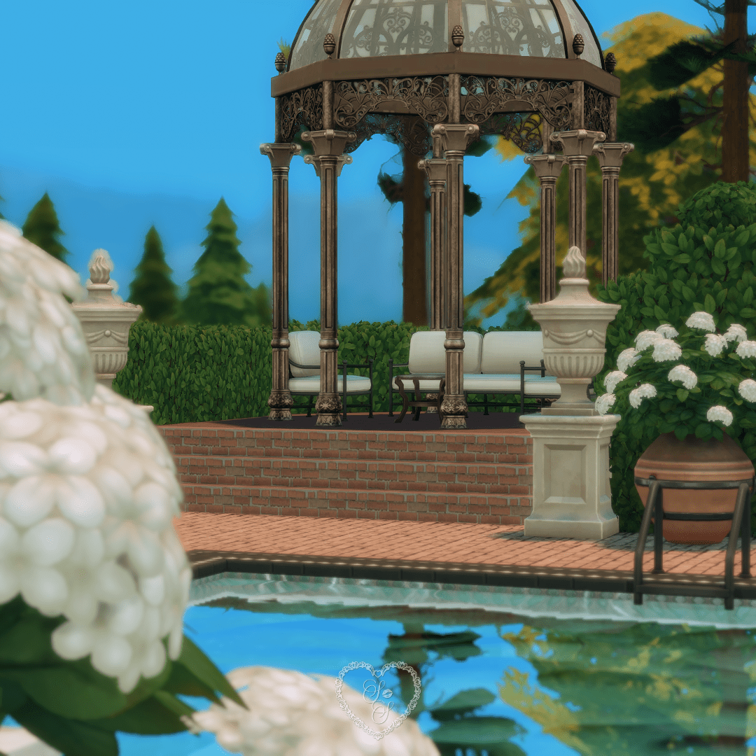 Ornate metal gazebo framed by classic planters and florals, perfect for outdoor lounging in this Sims 4 Classic Colonial build.