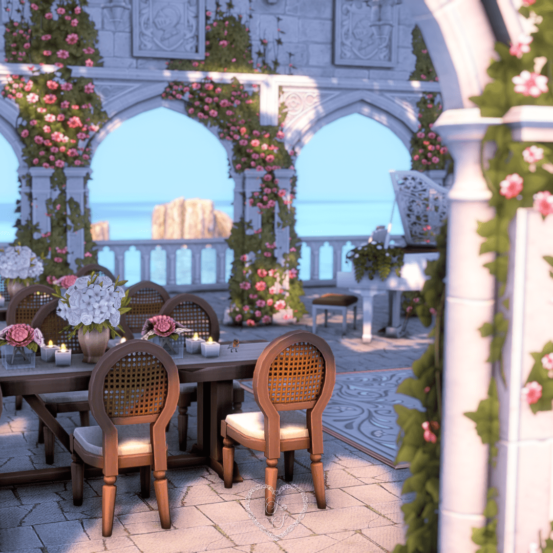 Elegant outdoor dining pavilion with ocean views, romantic florals, and candlelit tables.